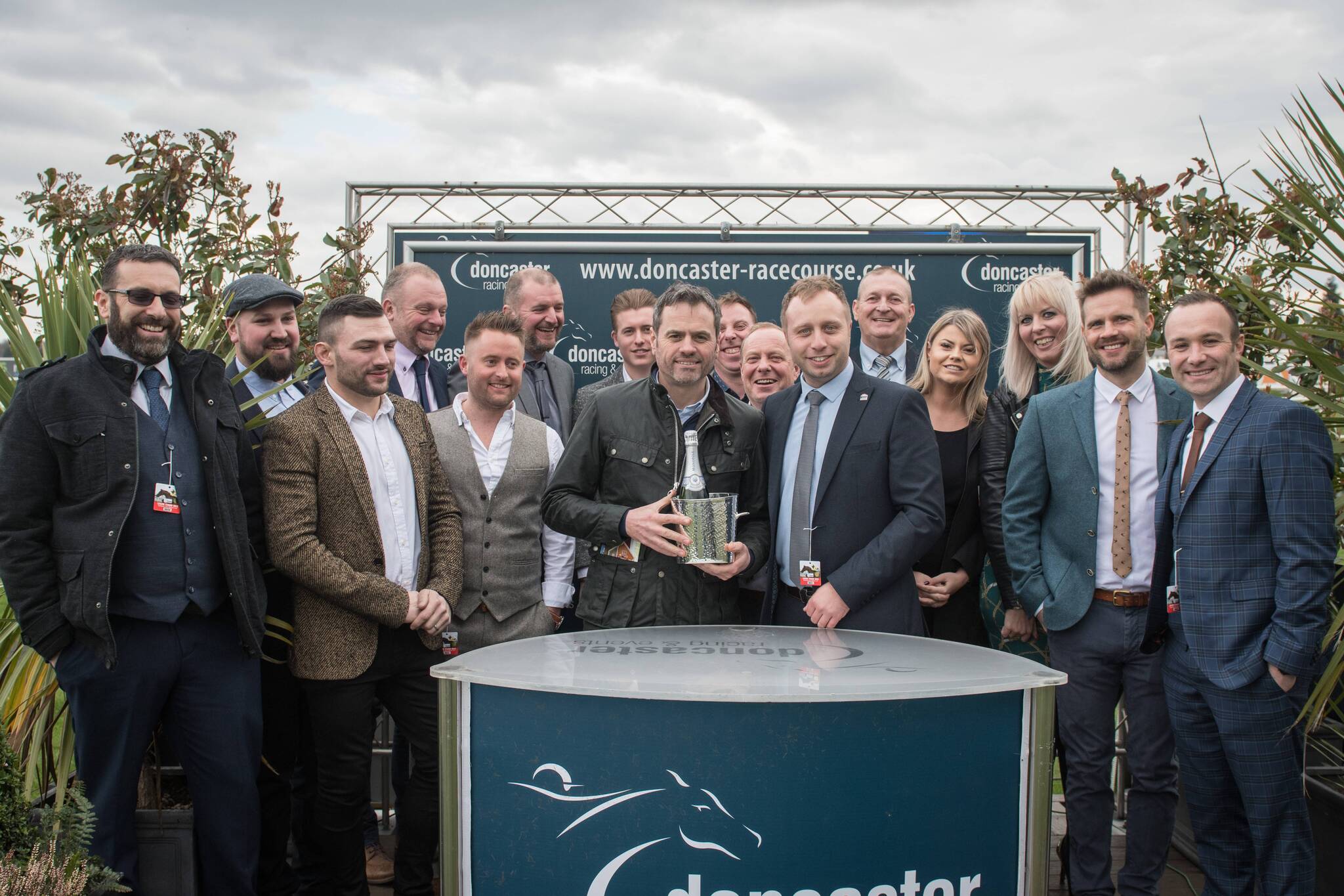 Winners of the Polypipe novice hurdles MKM Branch Director Glenn Paddison is pictured presenting the trophy to Charlie along with Hannah, Liz and the rest of the team from the MKM branch.